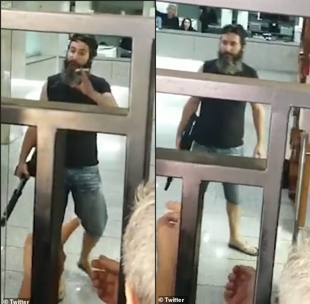 Man armed with a shotgun holds bank staff hostage and threatens to set himself on fire unless they hand over $200,000 locked in his account (videos)