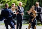 Women pose topless beside German leader Olaf Scholz to protest against Germany